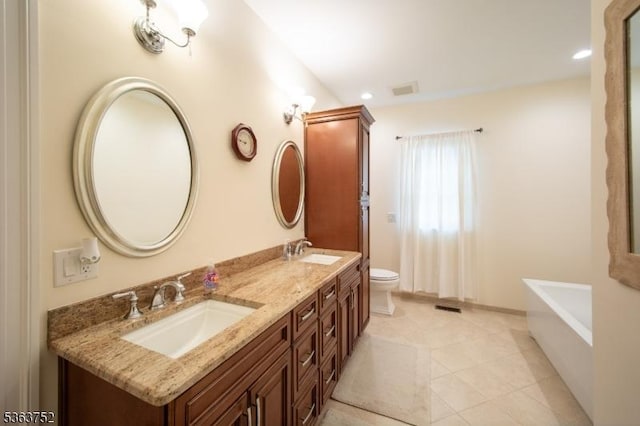 42 Bluffs Ct, Hamburg Boro, NJ 07419 - bathroom featuring toilet, double vanity, a tub, recessed lighting, and tile patterned flooring