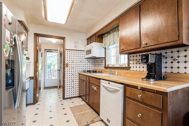 24 Forest Dr, Roxbury Twp, NJ 07876 - kitchen featuring stainless steel appliances, plenty of natural light, light floors, and a sink