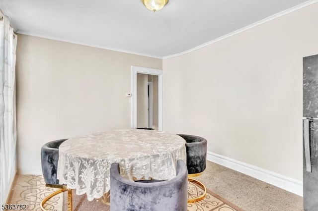410-412 Kerrigan Blvd, Newark City, NJ 07106 - dining area featuring baseboards, ornamental molding, and light carpet