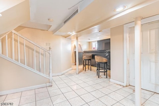 410-412 Kerrigan Blvd, Newark City, NJ 07106 - basement with stairway, baseboards, a dry bar, and tile patterned floors