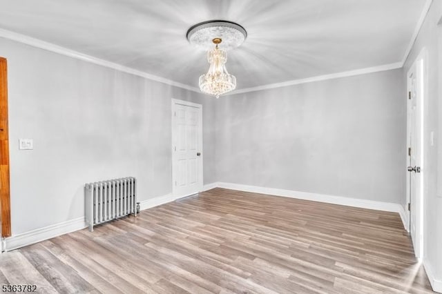 410-412 Kerrigan Blvd, Newark City, NJ 07106 - unfurnished room featuring radiator, a chandelier, wood finished floors, ornamental molding, and baseboards