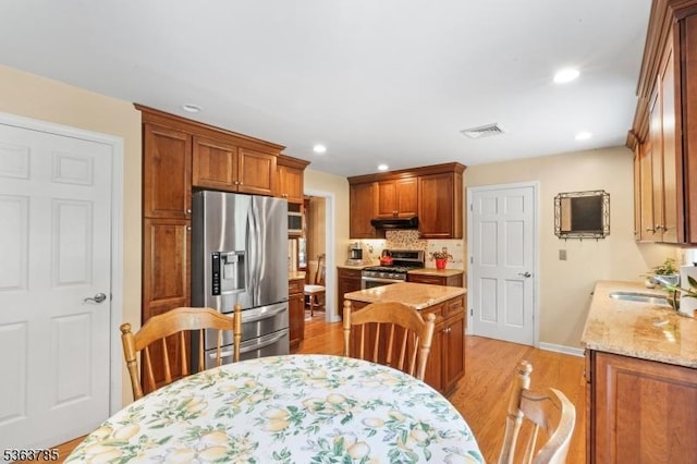 28 Douglas Dr, Washington Twp, NJ 07853 - kitchen with stainless steel appliances, ventilation hood, light wood-type flooring, recessed lighting, and light stone counters