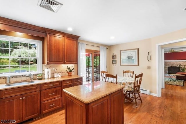 28 Douglas Dr, Washington Twp, NJ 07853 - kitchen featuring light wood-type flooring, tasteful backsplash, a center island, light stone countertops, and recessed lighting