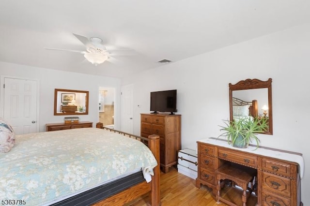 28 Douglas Dr, Washington Twp, NJ 07853 - bedroom with light wood-type flooring, connected bathroom, and ceiling fan