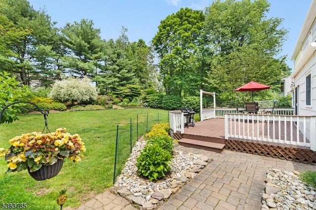 28 Douglas Dr, Washington Twp, NJ 07853 - view of green lawn featuring a wooden deck and outdoor dining space