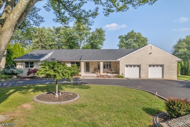39 Mildred Ter, Clark Twp, NJ 07066 - single story home with brick siding, driveway, and a garage