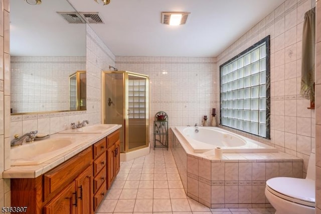 39 Mildred Ter, Clark Twp, NJ 07066 - full bathroom featuring tile walls, tile patterned floors, a bath, a shower stall, and double vanity