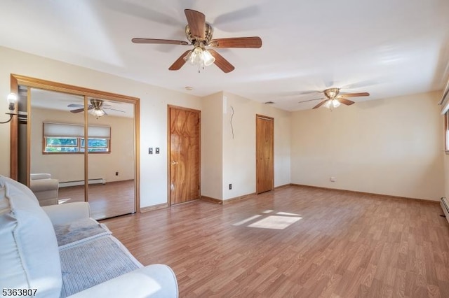 39 Mildred Ter, Clark Twp, NJ 07066 - living room featuring baseboard heating, light wood finished floors, and ceiling fan