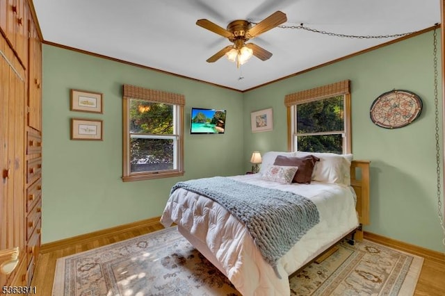 214 Glenside Pl, North Plainfield Boro, NJ 07060 - bedroom featuring multiple windows, crown molding, light wood-style floors, and ceiling fan
