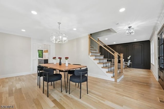 68 Irving Ave, Livingston Twp, NJ 07039 - dining room featuring a chandelier, stairs, recessed lighting, crown molding, and light wood-style floors