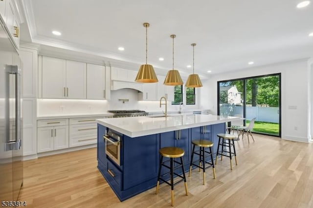 68 Irving Ave, Livingston Twp, NJ 07039 - kitchen with blue cabinets, appliances with stainless steel finishes, white cabinets, light countertops, and recessed lighting