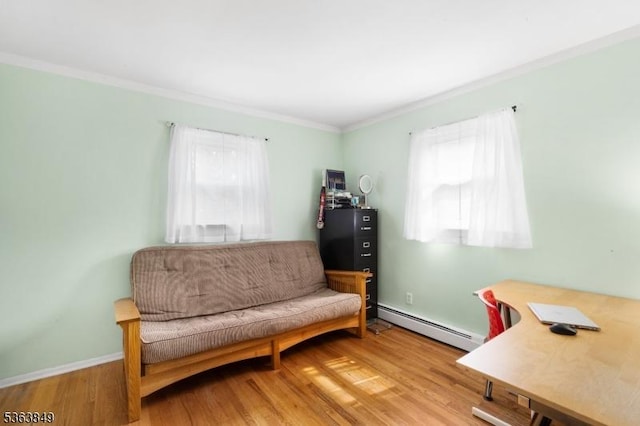 2001 Grant Ave, South Plainfield Boro, NJ 07080 - sitting room with a baseboard heating unit, crown molding, wood finished floors, and baseboards