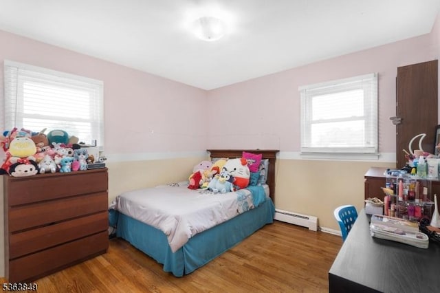 2001 Grant Ave, South Plainfield Boro, NJ 07080 - bedroom featuring baseboard heating and wood finished floors