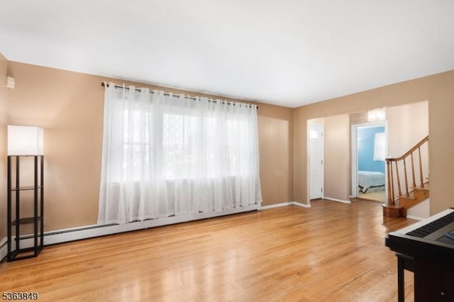 2001 Grant Ave, South Plainfield Boro, NJ 07080 - unfurnished living room featuring stairs, wood finished floors, and baseboards