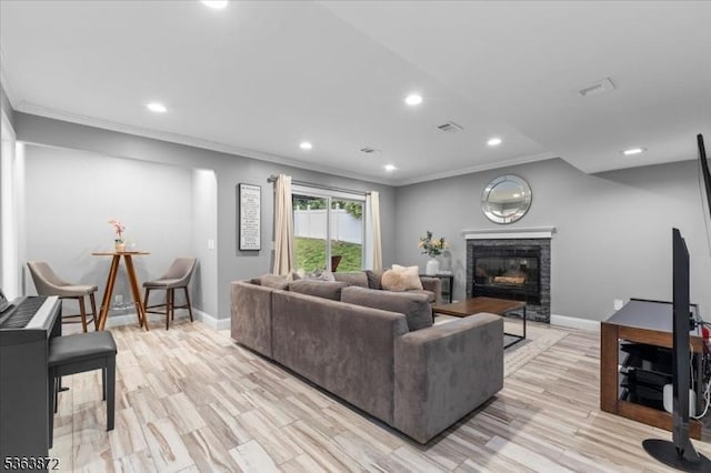 301 Diamond Hill Rd, Berkeley Heights Twp, NJ 07922 - living area with ornamental molding, recessed lighting, a stone fireplace, and light wood-style flooring