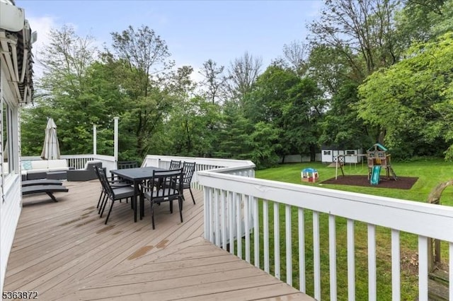 301 Diamond Hill Rd, Berkeley Heights Twp, NJ 07922 - wooden terrace with a playground, outdoor dining space, a lawn, and view of wooded area