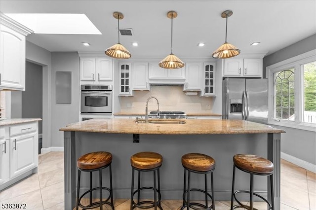 301 Diamond Hill Rd, Berkeley Heights Twp, NJ 07922 - kitchen featuring appliances with stainless steel finishes, a skylight, white cabinetry, backsplash, and recessed lighting
