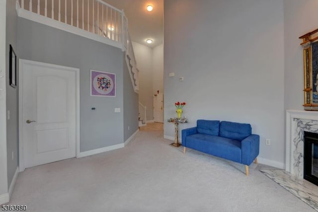 2409 Ramapo Ct, Riverdale Boro, NJ 07457 - living area featuring carpet floors, stairway, and a fireplace