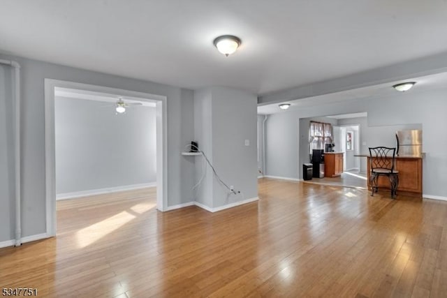 136 Willow St, Bloomfield Twp, NJ 07003 - unfurnished living room featuring light wood-type flooring, a ceiling fan, and baseboards