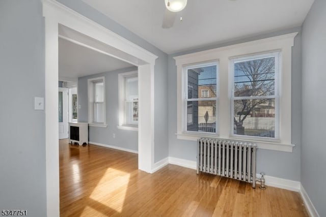 136 Willow St, Bloomfield Twp, NJ 07003 - spare room with radiator, wood finished floors, and baseboards