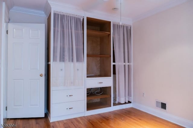2 Monsey Rd, Raritan Twp, NJ 08822 - unfurnished bedroom with baseboards, crown molding, and light wood-style flooring