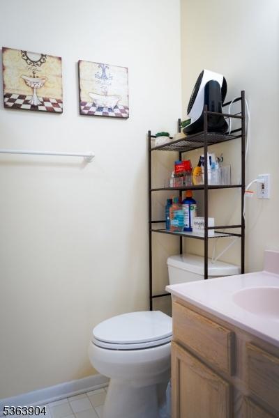 2 Monsey Rd, Raritan Twp, NJ 08822 - half bath with toilet, vanity, and tile patterned floors