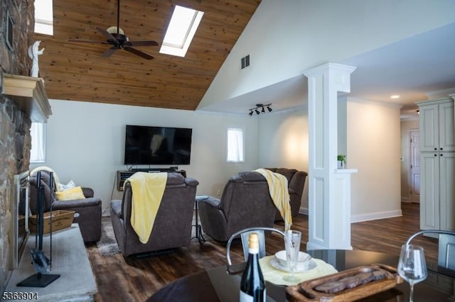 2 Monsey Rd, Raritan Twp, NJ 08822 - living room with high vaulted ceiling, dark wood-style floors, a skylight, a ceiling fan, and ornate columns