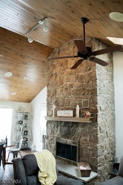2 Monsey Rd, Raritan Twp, NJ 08822 - living room with wood ceiling, ceiling fan, a fireplace, and high vaulted ceiling