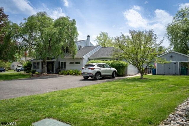 2 Monsey Rd, Raritan Twp, NJ 08822 - view of grassy yard featuring asphalt driveway