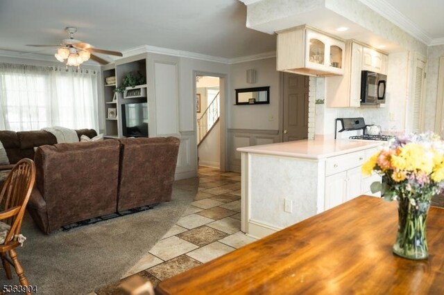 2 Monsey Rd, Raritan Twp, NJ 08822 - kitchen featuring white stove, black microwave, ornamental molding, a ceiling fan, and glass insert cabinets