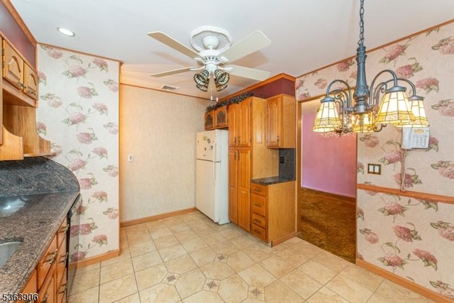 158 Fieldcrest Rd, Parsippany-Troy Hills Twp, NJ 07054 - kitchen featuring freestanding refrigerator, wallpapered walls, a chandelier, ceiling fan, and dark stone counters