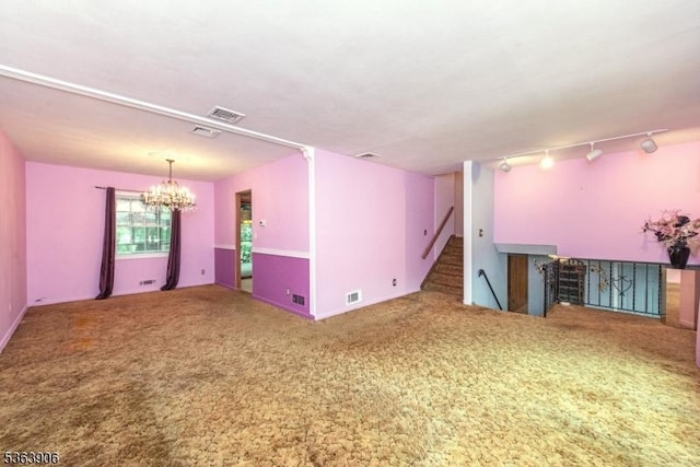 158 Fieldcrest Rd, Parsippany-Troy Hills Twp, NJ 07054 - carpeted empty room with a chandelier, stairway, and track lighting