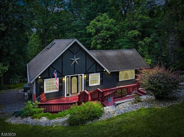 23 Panorama Dr, Vernon Twp, NJ 07461 - rear view of house with a deck, a forest view, and a shingled roof