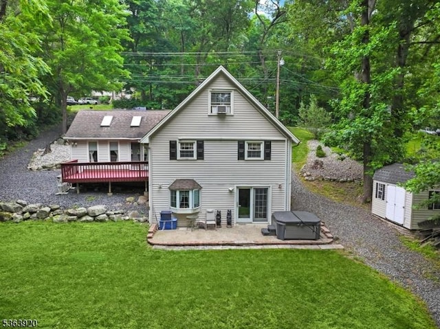 23 Panorama Dr, Vernon Twp, NJ 07461 - rear view of property featuring a storage unit, a deck, a patio area, a yard, and a hot tub