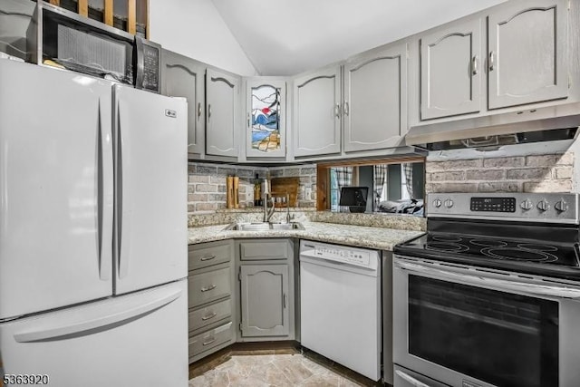 23 Panorama Dr, Vernon Twp, NJ 07461 - kitchen featuring white appliances, under cabinet range hood, gray cabinets, vaulted ceiling, and backsplash