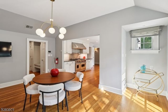 75 Farley Rd, Millburn Twp, NJ 07078 - dining space featuring vaulted ceiling and light wood-type flooring