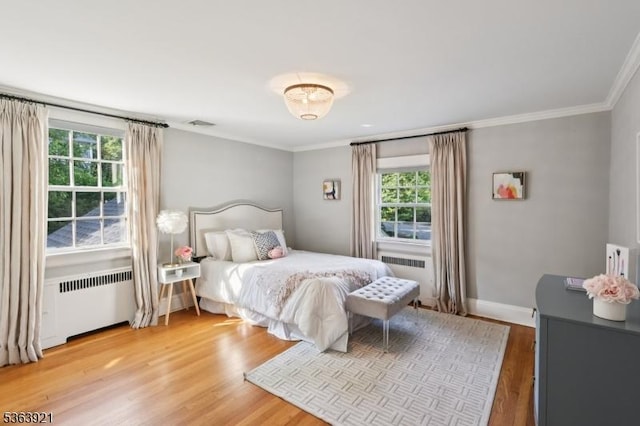 75 Farley Rd, Millburn Twp, NJ 07078 - bedroom with radiator heating unit, ornamental molding, and light wood-style flooring
