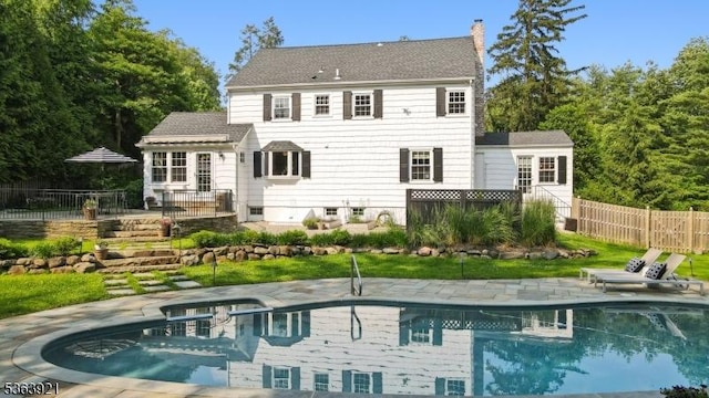 75 Farley Rd, Millburn Twp, NJ 07078 - rear view of house with a patio area and a chimney