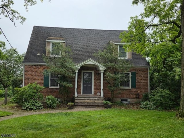 745 State Route 94, Frelinghuysen Twp, NJ 07860 - cape cod-style house with a front yard, brick siding, and a shingled roof