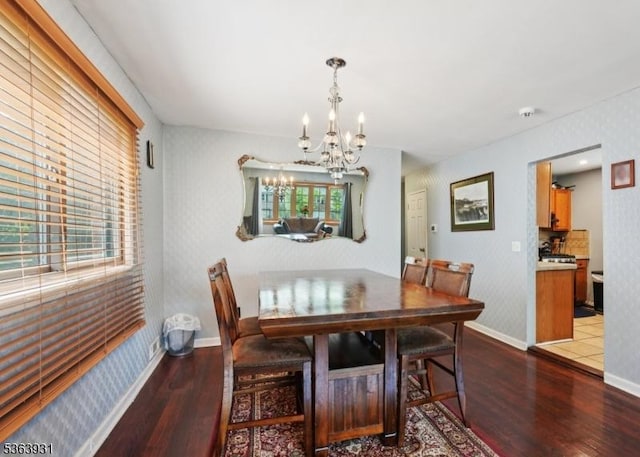 9 Lee Ct, Maplewood Twp, NJ 07040 - dining space featuring wood finished floors, a chandelier, and wallpapered walls