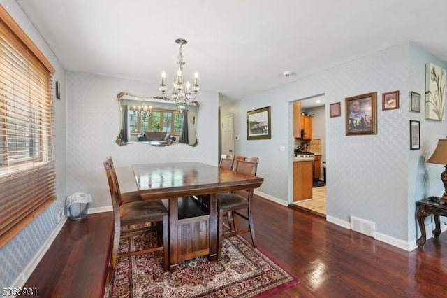 9 Lee Ct, Maplewood Twp, NJ 07040 - dining area featuring a chandelier, wood finished floors, healthy amount of natural light, and wallpapered walls