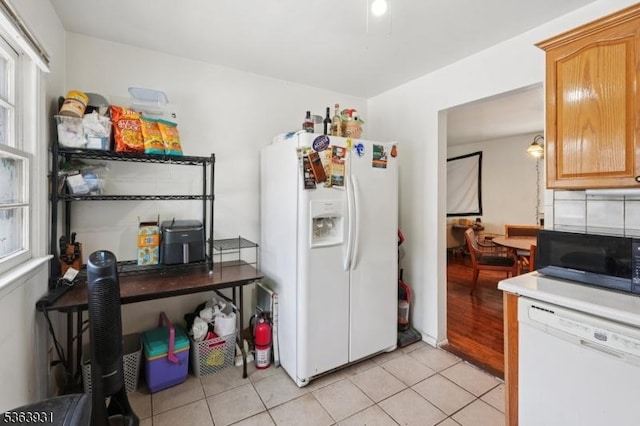 9 Lee Ct, Maplewood Twp, NJ 07040 - kitchen with white appliances, light tile patterned flooring, and light countertops