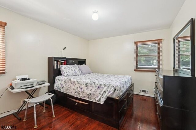 9 Lee Ct, Maplewood Twp, NJ 07040 - bedroom featuring dark wood-style flooring and baseboards