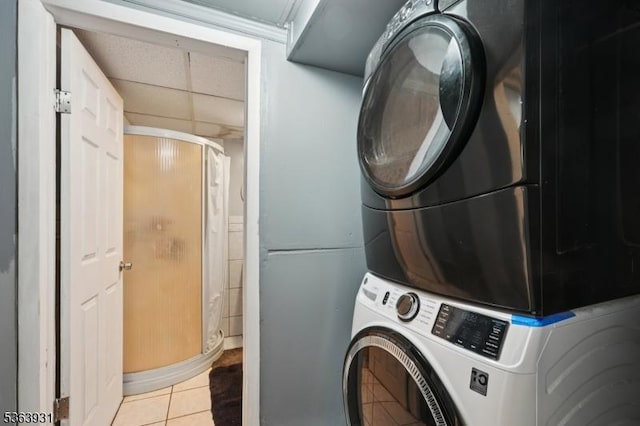 9 Lee Ct, Maplewood Twp, NJ 07040 - laundry area with stacked washing machine and dryer and light tile patterned flooring