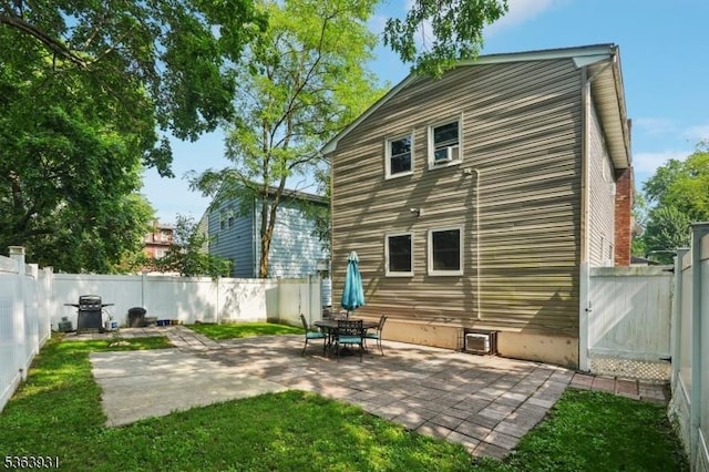 9 Lee Ct, Maplewood Twp, NJ 07040 - back of property with a fenced backyard and a patio area