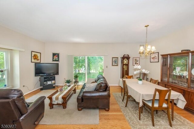 25 Maple Ln, Mount Arlington Boro, NJ 07856 - living area with a chandelier and light wood-style floors
