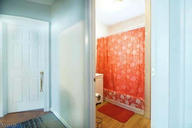 63 Grove St, Bloomfield Twp, NJ 07003 - full bath featuring wood finished floors and a shower with curtain