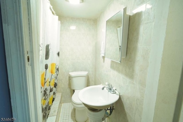 63 Grove St, Bloomfield Twp, NJ 07003 - bathroom with tile walls and tile patterned flooring