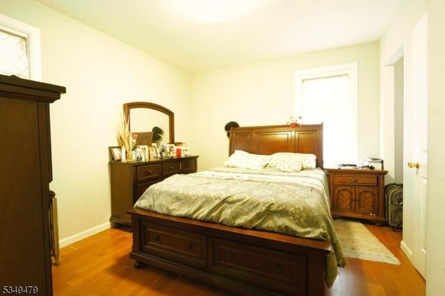 63 Grove St, Bloomfield Twp, NJ 07003 - bedroom featuring wood finished floors and baseboards