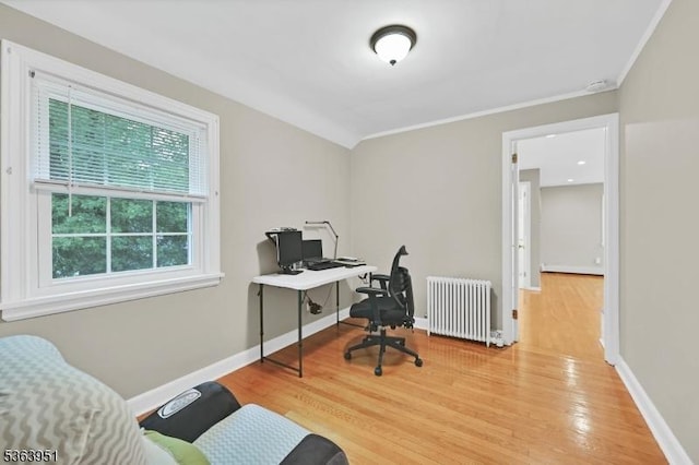 329 Hillside Ave, Livingston Twp, NJ 07039 - office area featuring radiator heating unit, wood finished floors, and ornamental molding